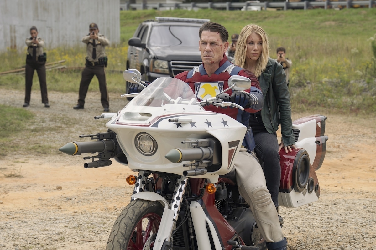 Peacemaker and Hardcore on Peacemaker's motorcycle