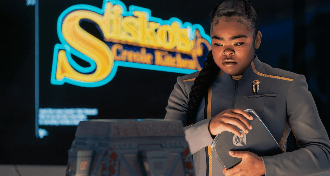 SAM SAM standing in front of a sign for Sisko's Creole Kitchen on Star Trek: Starfleet Academy.