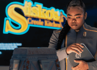 The Beat’s STAR TREK: STARFLEET ACADEMY “Series Acclimation Mil” spoiler roundtable SAM standing in front of a sign for Sisko's Creole Kitchen on Star Trek: Starfleet Academy.