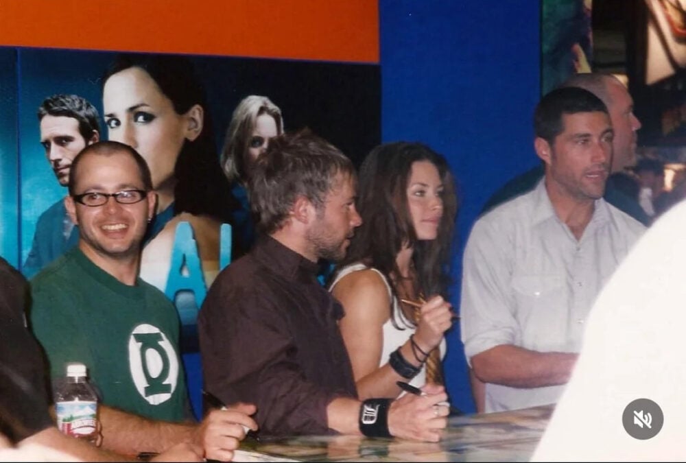 The picture Lindelof (left) shared of himself wearing a Green Lantern shirt in 2004. Dominic Monaghan, Evangeline Lilly, and Matthew Fox are to his right.