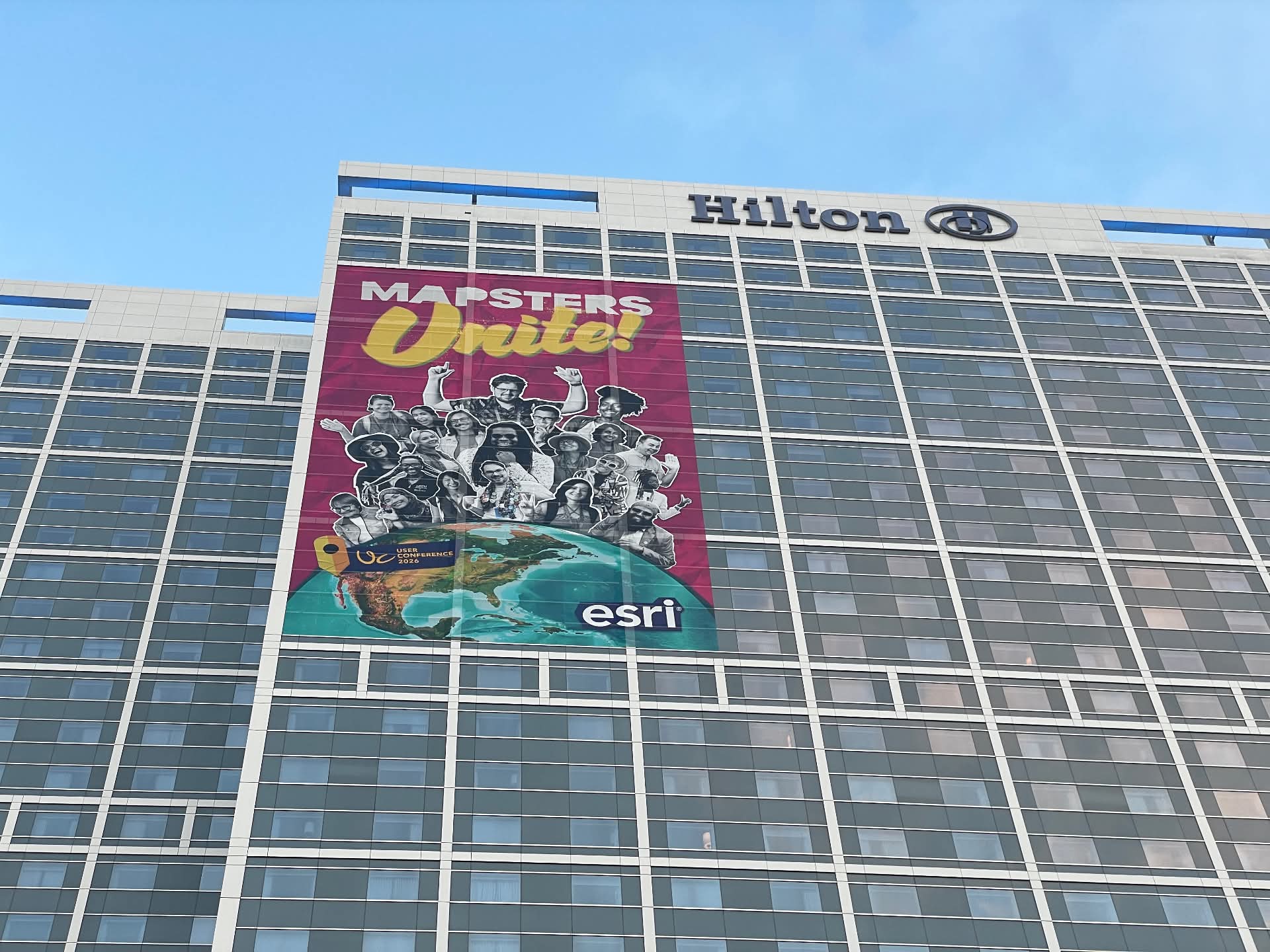 photo of the bayfront hilton with a Mapsters Unite banner on it
