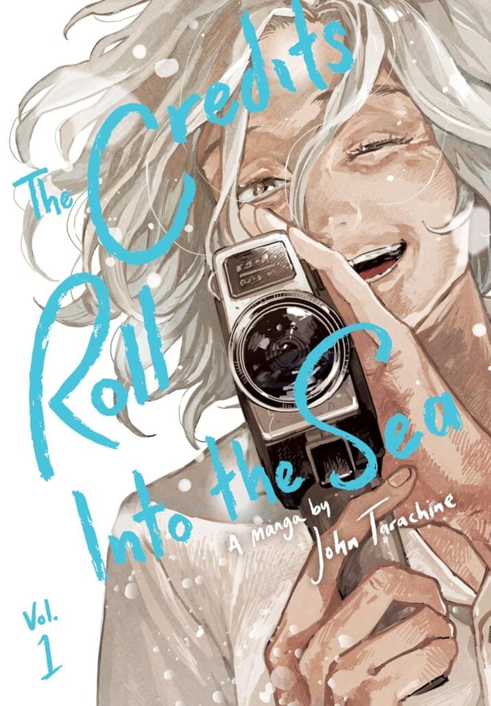 The cover of The Credits Roll Into the Sea. An older woman smiles as she holds a movie camera. One of her eyes is closed.
