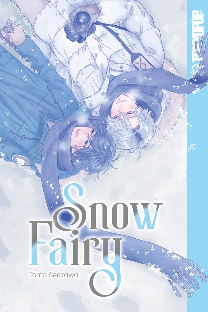 The cover of Snow Fairy. Two men lie side by side in teh snow. They are both wearing jackets and long purple scarves.
