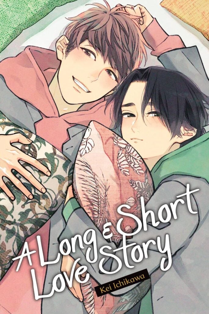 The cover of A Long and Short Love Story, depicting two young men lying side by side while holding pillows. They are wearing red and green hoodies respectively.