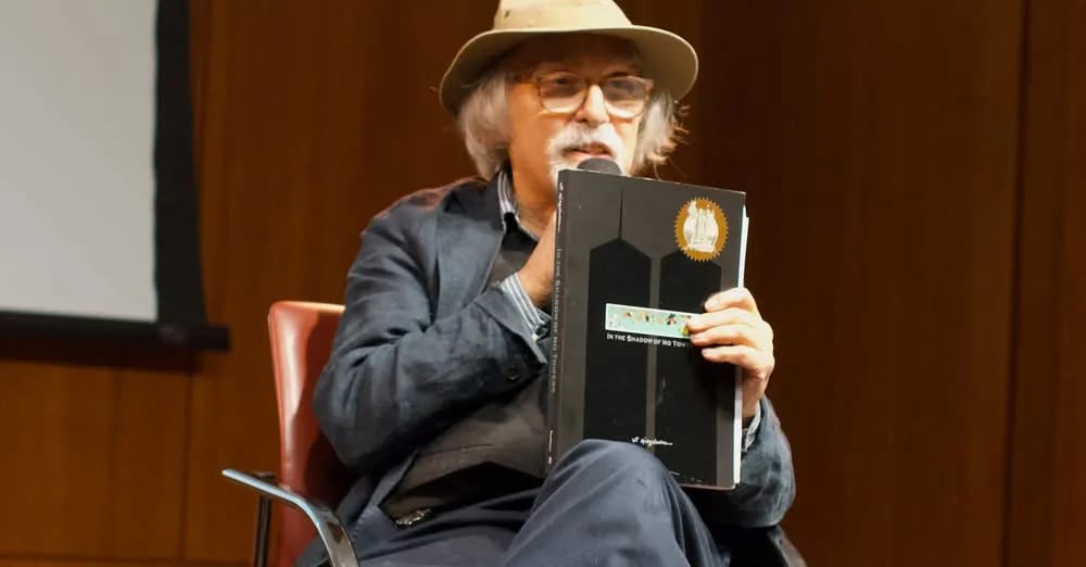 Art Spiegelman holding up the new edition of In the Shadow of No Towers. The sticker is on the upper right corner of the cover. Photo courtesy of Zach Rabiroff